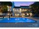 Outdoor living area showcasing a large swimming pool and multiple seating areas at 4039 5Th Nw St, Hickory, NC 28601