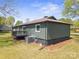 Back exterior view of a home with siding, a metal roof, and a small porch at 4115 Conley St, Newton, NC 28658