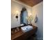 Charming bathroom features a wood counter with vessel sink, custom mirror, and modern lighting at 4115 Conley St, Newton, NC 28658