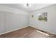 A bright bedroom featuring wood flooring and a large window for great natural lighting at 4115 Conley St, Newton, NC 28658