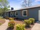 Charming ranch style home with wood deck, green siding, brown accents, and pathway to front door at 4115 Conley St, Newton, NC 28658