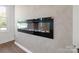 A modern electric fireplace adorns this lovely, sunlit living space at 4115 Conley St, Newton, NC 28658