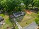 Aerial view of a home with a large yard and mature trees at 4544 Craig Ave, Charlotte, NC 28211