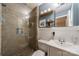Updated bathroom featuring a glass-enclosed shower, modern vanity, and stylish fixtures offers a spa-like experience at 4544 Craig Ave, Charlotte, NC 28211