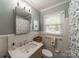 Cozy bathroom featuring a shower-tub combo and modern vanity offers a functional and stylish space to refresh and relax at 4544 Craig Ave, Charlotte, NC 28211