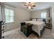 Bright bedroom features soft carpeting, neutral walls, and large windows providing ample natural light and a relaxing atmosphere at 4544 Craig Ave, Charlotte, NC 28211