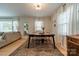 Inviting dining area with natural light, an antique sideboard and a view to the living room at 4544 Craig Ave, Charlotte, NC 28211