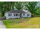 Inviting single-story home with a gray facade and a neatly landscaped front yard at 4544 Craig Ave, Charlotte, NC 28211