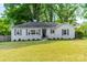 Charming single-story home with a well-manicured lawn and classic design features at 4544 Craig Ave, Charlotte, NC 28211