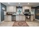 Well-maintained kitchen featuring stainless steel appliances, white cabinets, and black countertops at 4544 Craig Ave, Charlotte, NC 28211