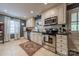 Bright kitchen with stainless steel appliances, white cabinets, and tile backsplash at 4544 Craig Ave, Charlotte, NC 28211