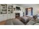 Comfortable living room boasts a fireplace, built-in shelving, and a cozy sectional sofa at 4544 Craig Ave, Charlotte, NC 28211