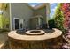 Paver patio featuring a built-in fire pit with seating, perfect for enjoying evenings outdoors at 4861 Samuel Pinckney Dr, Belmont, NC 28012