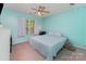 Calming bedroom with a ceiling fan, a window offering natural light, and soft color scheme for a tranquil setting at 4861 Samuel Pinckney Dr, Belmont, NC 28012
