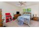Comfortable bedroom with a ceiling fan, large window, and a neutral color scheme for a warm and inviting atmosphere at 4861 Samuel Pinckney Dr, Belmont, NC 28012
