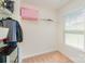 Walk-in closet with carpeted floor, adjustable shelving, and a window for natural light at 4861 Samuel Pinckney Dr, Belmont, NC 28012