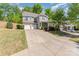 Attractive two-story home featuring a spacious driveway and meticulously maintained landscaping at 4861 Samuel Pinckney Dr, Belmont, NC 28012