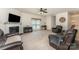 Inviting living room with plush seating, a cozy fireplace, and a large window for natural light at 4861 Samuel Pinckney Dr, Belmont, NC 28012