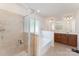 Bright main bathroom with tile shower, soaking tub, and spacious vanity at 4861 Samuel Pinckney Dr, Belmont, NC 28012
