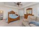 Elegant main bedroom with ceiling fan, wooden furniture, and comfortable recliner at 4861 Samuel Pinckney Dr, Belmont, NC 28012