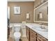 Bathroom with toilet, sink, and mirror at 4935 Kennedy St, Hickory, NC 28602