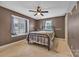 Bedroom with carpet, window, and ceiling fan at 4935 Kennedy St, Hickory, NC 28602