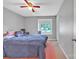 Cozy bedroom features a ceiling fan and window allowing for natural light at 4935 Kennedy St, Hickory, NC 28602