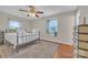 Bedroom with window, ceiling fan, and hardwood floor at 4935 Kennedy St, Hickory, NC 28602