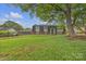 Charming two-story home with brick facade, manicured lawn, and mature trees creates a welcoming curb appeal at 4935 Kennedy St, Hickory, NC 28602
