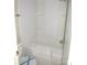 Clean bathroom featuring a shower-tub combination with a white tile surround and built in shelving at 5180 Macedonia Church Rd, Vale, NC 28168