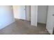 The bedroom features plush carpeting, neutral walls, and a closet with a door to another space at 5180 Macedonia Church Rd, Vale, NC 28168