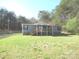 Charming home featuring a covered front porch and surrounded by lush greenery at 5180 Macedonia Church Rd, Vale, NC 28168