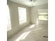 Sunlit living area featuring tile flooring and multiple windows for ample natural light at 5180 Macedonia Church Rd, Vale, NC 28168