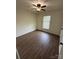 This bedroom features a ceiling fan and newer floors at 629 Belmorrow Dr, Charlotte, NC 28214