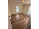 This bedroom features natural light and updated floors at 629 Belmorrow Dr, Charlotte, NC 28214