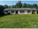 Charming single-story brick home with red shutters and a large front lawn at 629 Belmorrow Dr, Charlotte, NC 28214