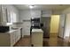 Updated kitchen featuring white cabinets, stainless steel appliances, and a kitchen island at 629 Belmorrow Dr, Charlotte, NC 28214