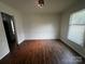 Spacious living room featuring wood-look flooring and natural light at 629 Belmorrow Dr, Charlotte, NC 28214
