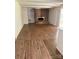 Living room with brick fireplace, built-in shelves, and wood-look flooring at 629 Belmorrow Dr, Charlotte, NC 28214