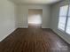 Bright living room with wood flooring and a large window at 629 Belmorrow Dr, Charlotte, NC 28214