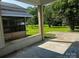 Open porch with brick detailing and view of yard at 629 Belmorrow Dr, Charlotte, NC 28214