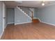 Basement space showcasing wood flooring, stairs, and gray walls at 668 Riverside Dr, Lincolnton, NC 28092