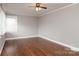 Bedroom featuring hardwood floors, a ceiling fan, and bright, natural light at 668 Riverside Dr, Lincolnton, NC 28092