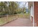 Expansive wooden deck offers outdoor space for entertaining with wooded view at 668 Riverside Dr, Lincolnton, NC 28092