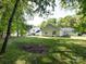 Spacious backyard showcasing the home's exterior and lush greenery, ideal for outdoor activities at 7731 Ivy Hollow Dr, Charlotte, NC 28227