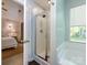 Bright bathroom featuring glass enclosed shower with a separate tub and natural lighting at 7731 Ivy Hollow Dr, Charlotte, NC 28227