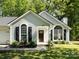 Charming single-story home with an inviting front yard, landscaped entrance, and an attached garage at 7731 Ivy Hollow Dr, Charlotte, NC 28227