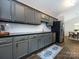 Well-lit kitchen featuring modern appliances, sleek countertops, and tile backsplash at 7731 Ivy Hollow Dr, Charlotte, NC 28227