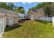 Landscaped backyard features a patio area, lawn, and well-maintained surroundings at 7850 Bud Henderson Rd, Huntersville, NC 28078