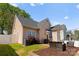 Beautiful backyard features a patio area, lush lawn, and privacy fence, creating a relaxing outdoor space at 7850 Bud Henderson Rd, Huntersville, NC 28078